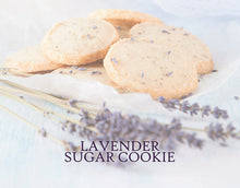 Load image into Gallery viewer, Label art for Lavender Sugar Cookie featuring black text and a background of sugar cookies sprinkled with lavender, as well as dried lavender stems in the foreground.
